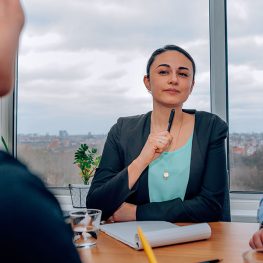 human resource doing an interview to applicant for a job position - businesswoman and businessman sitting at desk